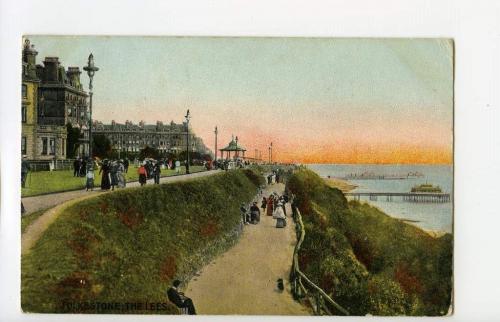A colourized postcard depicting the harbour of the seaside town of Folkestone, England.