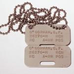 Rectangular metal dog tags.