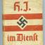 A beige hardcover manual with red writing, two red stripes and a black  swastika in the centre.