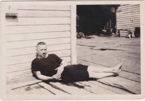 A black-and-white photograph of Byron Cooper Sisler relaxing.