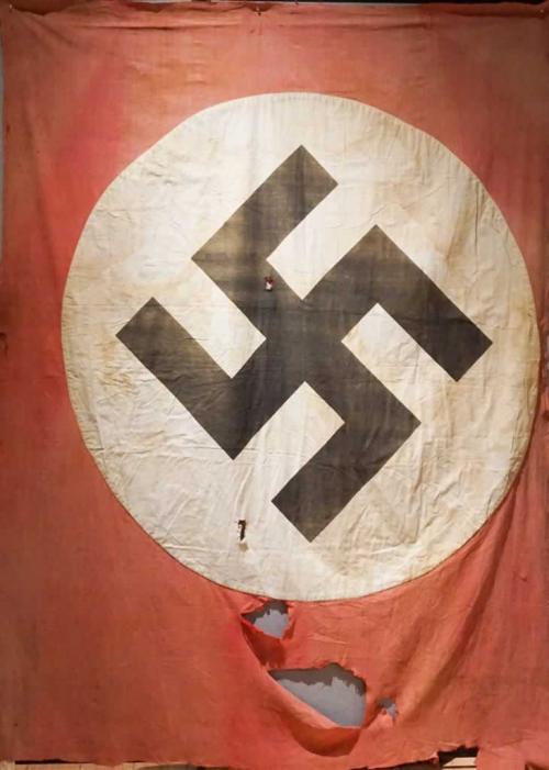 A classic red Nazi flag with the white circle with a black swastika in the center.