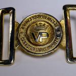 A gold-plated belt buckle inscribed with a crown and “Princess Patricia’s Canadian Light Infantry”.