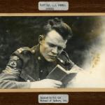 A black-and-white photograph of medic Staff Sergeant Leslie Farrell reading   a book.